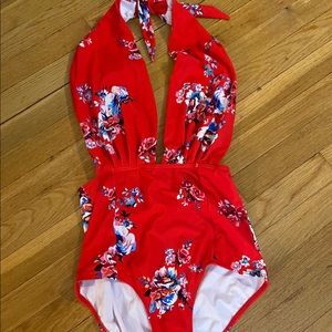 Never worn low cut one piece